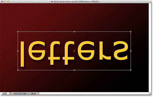 Photoshop text flipped vertically in the document. Image © 2011 Photoshop Essentials.com.