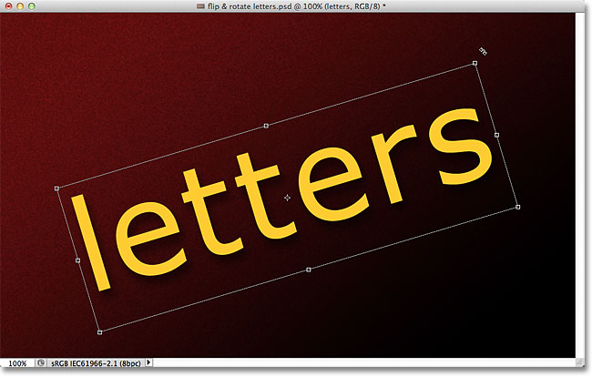 Rotating the text with Free Transform. Image © 2011 Photoshop Essentials.com.
